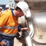 Columbia field representative examines a customer's dragline chain in Australia