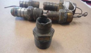Fig. 6 - Corroded hose fitting
