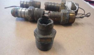 Fig. 6 - Corroded hose fitting