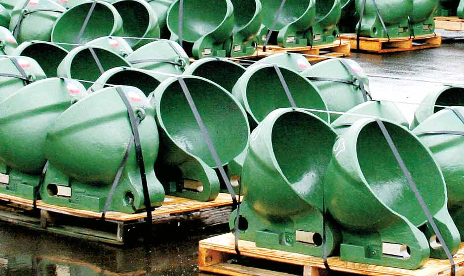 Pallets of Columbia Steel dredge buckets en route to an Alaskan gold mine